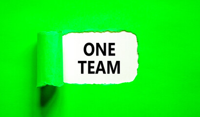 One team symbol. Concept word One team on beautiful white paper. Beautiful green paper background. Business one team concept. Copy space.