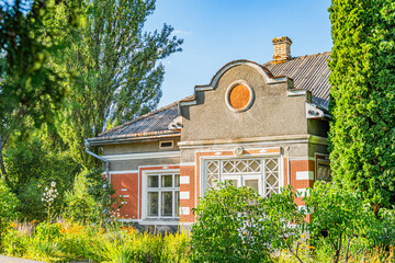 Ancient Central European village Two-story building with eclectic design, featuring classical and...