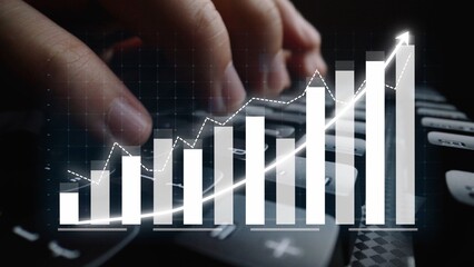 A dynamic representation of business growth showcasing hands engaging with a calculator amidst ascending charts and graphs depicting market performance trends. Copula