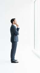 Businessman Looking Out a Large Window