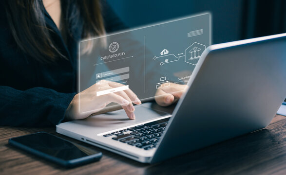 Businesswoman typing on laptop with digital cybersecurity login screen, symbolizing secure access, data protection, and online identity authentication in technology systems.