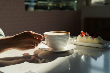 Female drinking morning cup of coffee