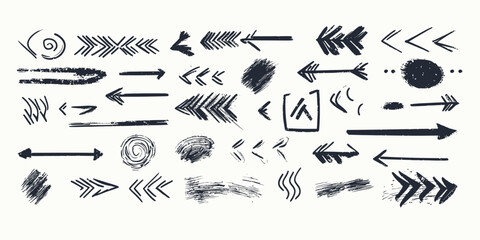 Obraz premium Hand drawn grunge arrow vector set with various brush stroke scribbles, chalk style sketch lines, spirals, directional elements for design and illustration