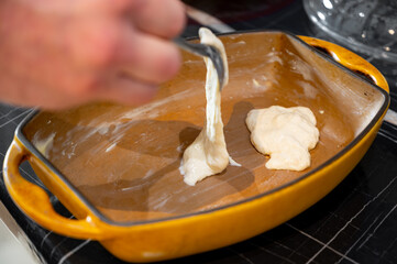 Pouring Liquid Dough into Ceramic Baking Dish