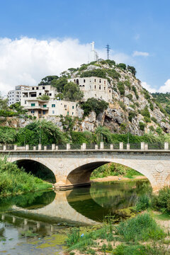 Historic bridge in Nahr el Kalb valley and Christ King statue, Zouk Mosbeh, Lebanon