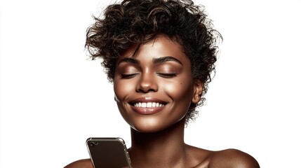 A beautiful black woman is smiling while holding a phone.