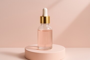 Elegant dropper bottle of pink serum on a pedestal