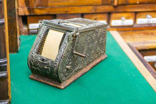 Vintage wooden cabinet in pharmacy setting, intricately carved and antiqued a