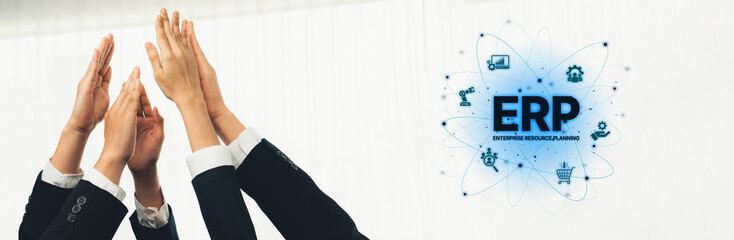 Hands raised together symbolize teamwork and achievement in a business context, showcasing the...