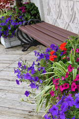 Flowers in a vase and bench near the house