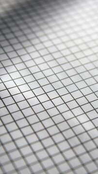 An abstract geometric grid of light and shadow, forming a compelling backdrop with an intriguing perspective.