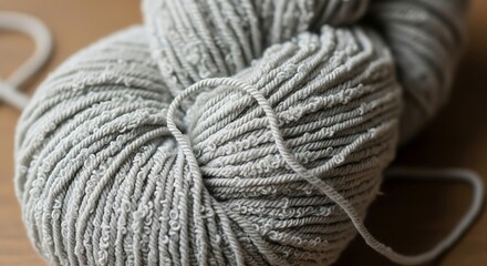 Close-up of a ball of gray yarn, ready for creative knitting crafts