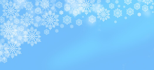 Blue winter sky with delicate snowflakes creating a peaceful, festive background design for stock photos
