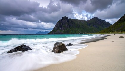 Dramatic coastal scene with turquoise waves lapping on a sandy beach