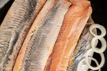Herring fillet fish fresh seafood portion size natural product tasty snack fresh delicious gourmet food background on the table rustic top view copy space pescetarian diet