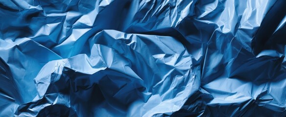 Obraz premium The Blue Crumpled Metallic Foil Texture for Abstract Background and Modern Design