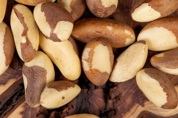 shelled brazilian nuts of vitamins , peeled nuts scattered on the table ready for meals