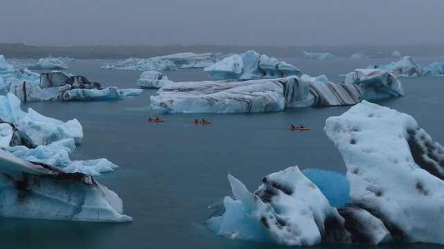 Kayakers Among Icebergs in a Glacier Lagoon