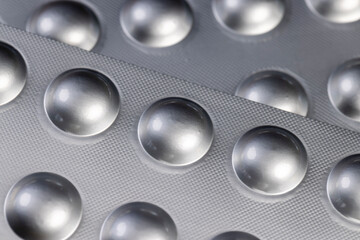 tablets packed in a silver blister for medical use, a new blister for storage of medicines, pill packaging details