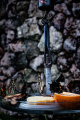 Colorful butterflies feeding on fruit in a serene garden setting in Denmark