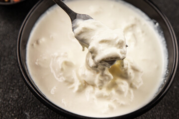 Stracciatella cheese soft young portion size Italian food natural product tasty snack fresh delicious gourmet food background on the table rustic top view copy space