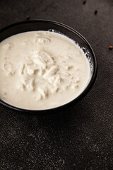 Stracciatella cheese soft young portion size Italian food natural product tasty snack fresh delicious gourmet food background on the table rustic top view copy space