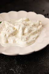 Stracciatella cheese soft young portion size Italian food natural product tasty snack fresh delicious gourmet food background on the table rustic top view copy space