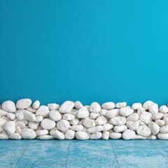 Simple arrangement of white stones against a teal background