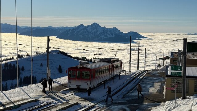 Rigi-Kulm, Switzerland - November 29, 2024: Vitznau-Rigi mountain railway at the Rigi-Kulm terminus on the summit in the snowy winter landscape.
