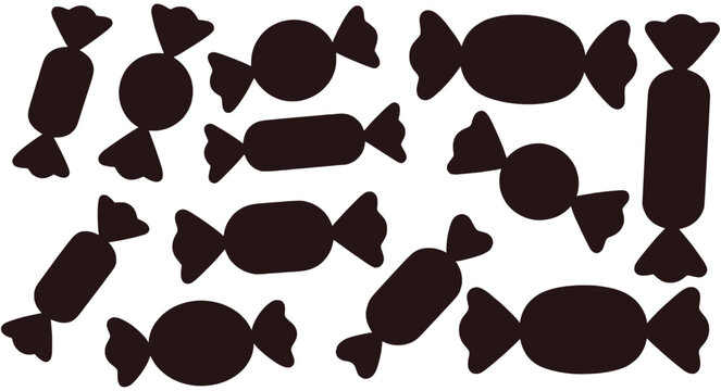 Dark brown candy wrappers scattered on white background sweets silhouette