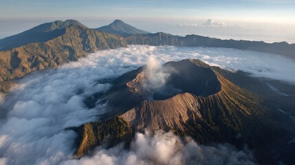 Volcanic crater shrouded in clouds, aerial view