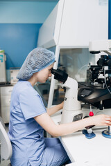 A young scientist working at a medical clinic conducts experiments in a laboratory.