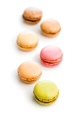 Different flavors of macarons. Colourful macaroons isolated on white background.