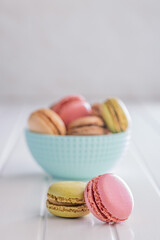 Different flavors of macarons. Colourful macaroons on white table.