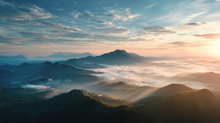 Sunrise over misty mountain range
