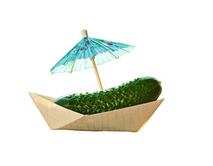 Cucumber boat appetizer with a paper parasol, resting on a white surface under sunlight.