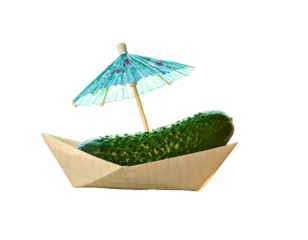 Cucumber boat appetizer with a paper parasol, resting on a white surface under sunlight.