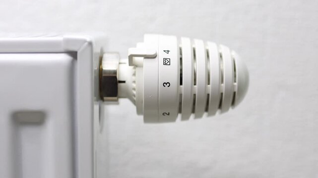 Heating radiator thermostat adjustment sequence, showcasing gradual increase in temperature settings, highlighting transition to colder seasons and enhanced warmth for indoor comfort