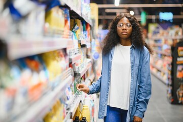 African American woman in a household chemical store