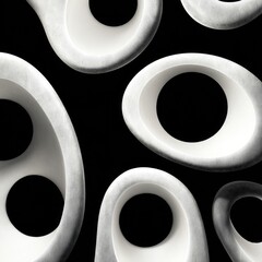 Abstract sculptural forms in shades of white, creating a captivating visual interplay against a black backdrop.