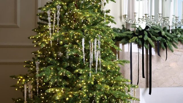 Christmas tree adorned with sparkling lights and icicle decorations, surrounded by elegant holiday decor and festive ambiance, creating a warm seasonal atmosphere