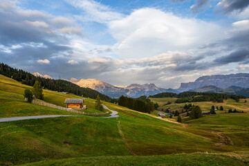 The UNESCO site Seiser Alm or Alpe di Siusi the Dolomite plateau and the largest high-elevation Alpine meadow  in Europe located in Italy's South Tyrol province in the Dolomites in autumn sunset.