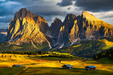 The UNESCO site Seiser Alm or Alpe di Siusi the Dolomite plateau and the largest high-elevation Alpine meadow  in Europe located in Italy's South Tyrol province in the Dolomites in autumn sunset.