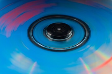 Abstract spinning disc with blue and red motion blur background