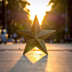 Golden star on pavement bathed in sunlight