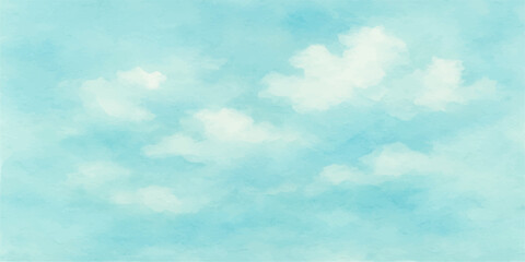 Fluffy white clouds drift across a beautiful bright blue summer sky