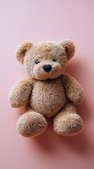 Obraz premium Cute teddy bear toy lying on pink background. 