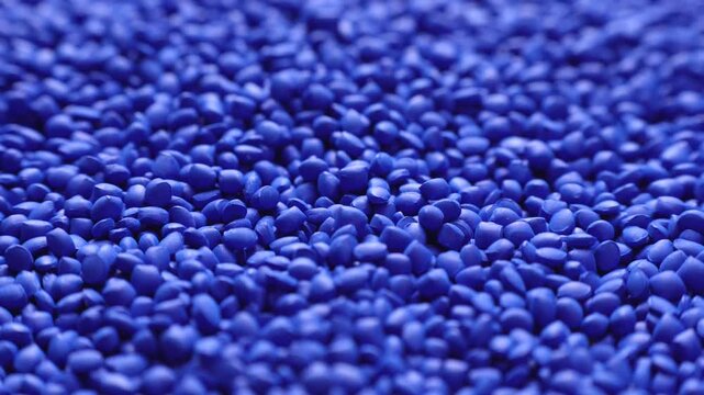 Blue polymer dye in granules, background texture