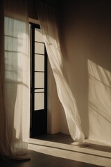 Sheer curtain gently swaying in the warm breeze through an open door, casting soft light and shadows across the minimalist room. A serene and contemplative moment of stillness in a slow living home.