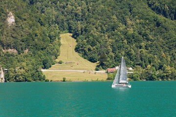 Sailing ship on Lake Lucerne with pastures in background © hajes